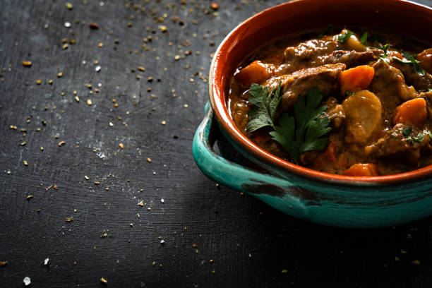 istock Beef goulash with vegetables on black table 2194945469