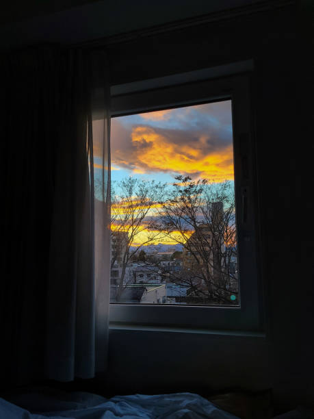 Vivid Sunset Framed by a Hotel Window in Maebashi, Japan