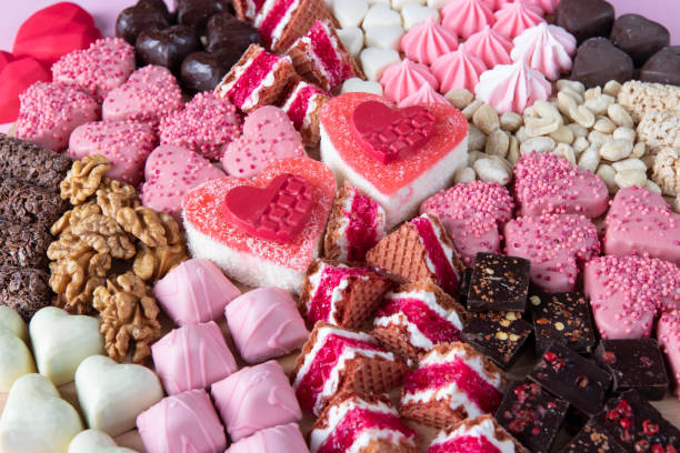 Sweets board assorted for Valentine's Day on pink background