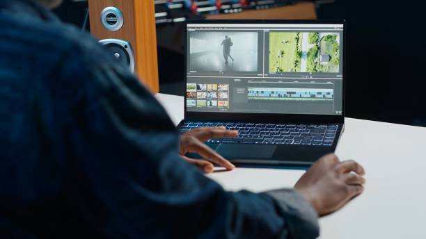 Videographer splicing film pieces on laptop, editing them Video editor trimming segments of drone shot footage, working on promotional clip in home office. Videographer splicing film pieces, editing them using professional software on laptop, camera A female film editor stock pictures, royalty-free photos & images