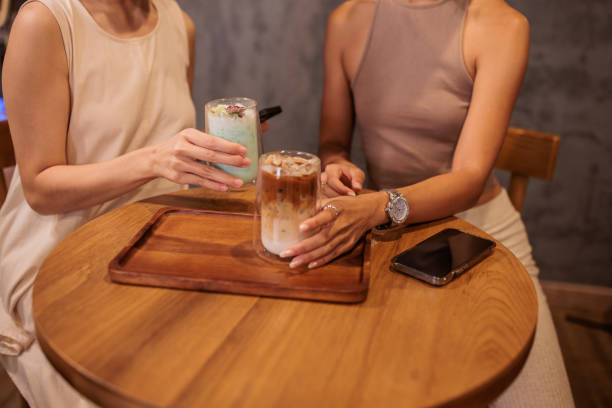 istock Women Enjoying Iced Latte's in Cafe 2194952768