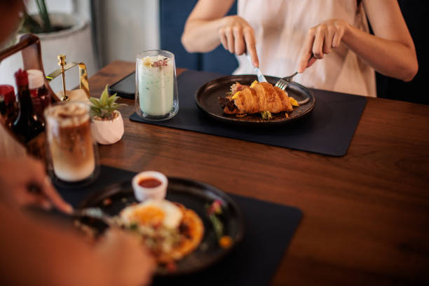 istock Women Having Breakfast in Cafe 2194953037