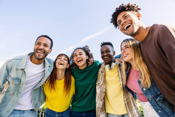 istock Young group of people having fun together outdoors in a sunny day 2194954067