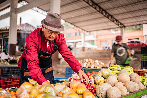 istock Salesman working on a farmer's market 2194957409