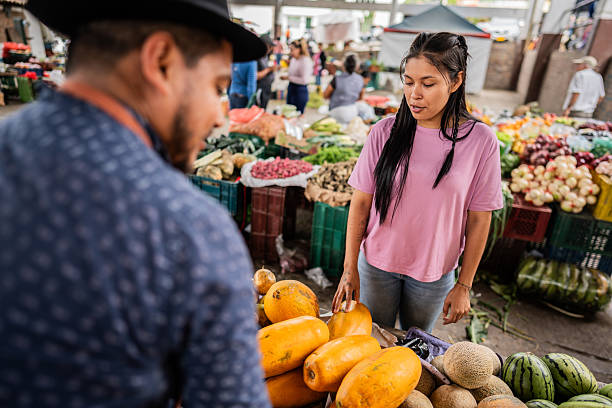 istock Customer talking with vendor on a farmer's market 2194957800