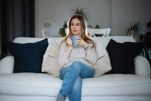 Beautiful woman relaxing and drinking hot tea