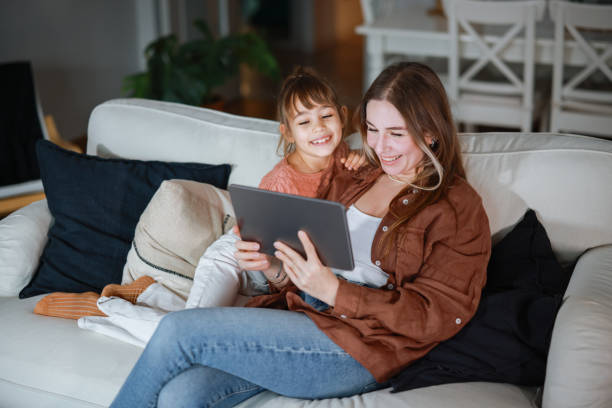 istock Mother and daughter using a digital tablet together 2194969100