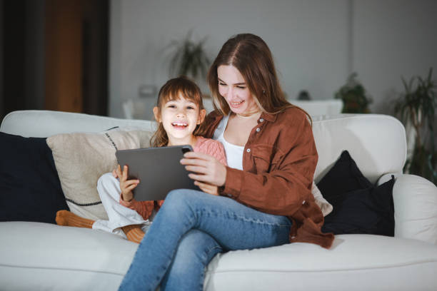 istock Mother and daughter using a digital tablet together 2194969498