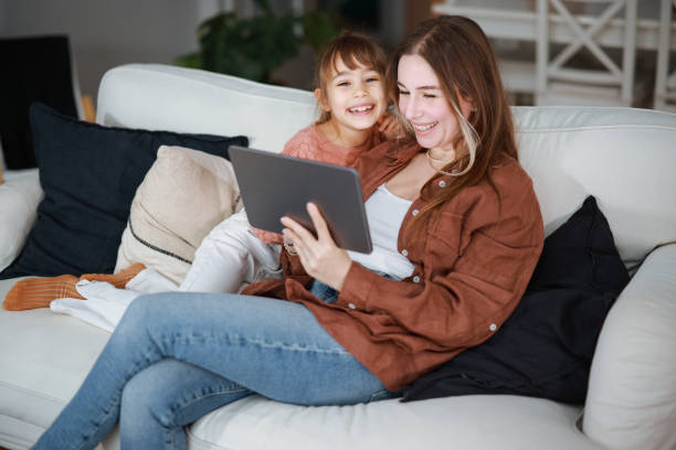 istock Mother and daughter using a digital tablet together 2194970241