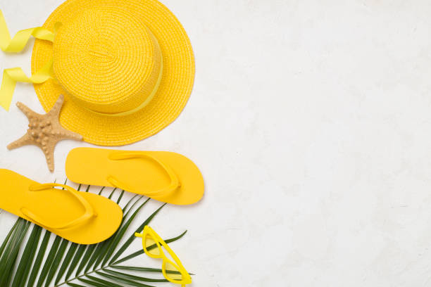 istock Flat lay with yellow summer outfit on concrete background. Vacation concept 2194972055