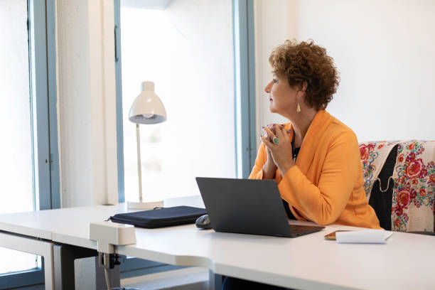 istock Thoughtful Businesswoman Looking Out the Window 2194972199