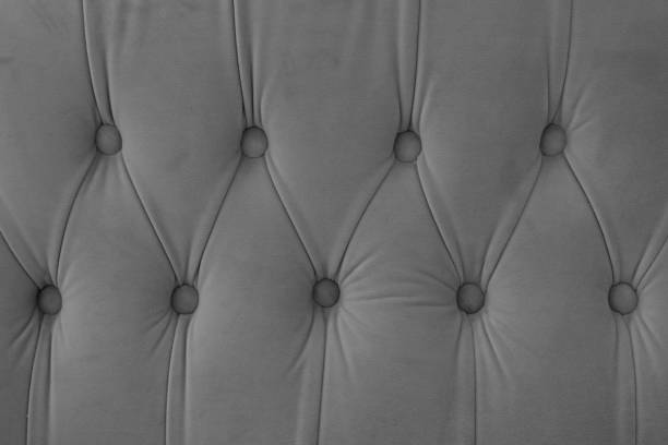 istock Capitone, Chesterfield style suede fabric texture, gray diamond buttoned gray background 2194974290