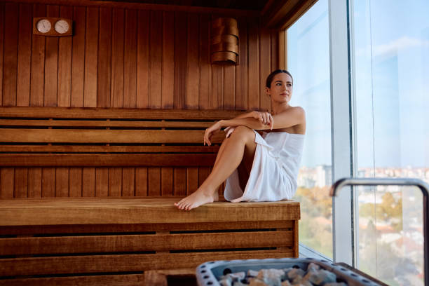 istock Pensive woman relaxing by the window in sauna. 2194976288