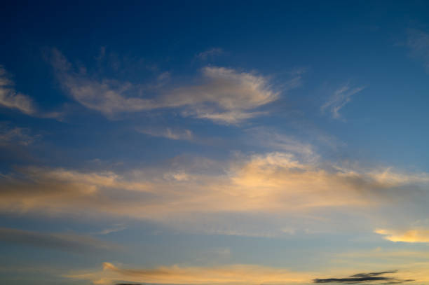 istock Twilight skies showcase delicate clouds and vibrant colors in a serene evening 2194976727