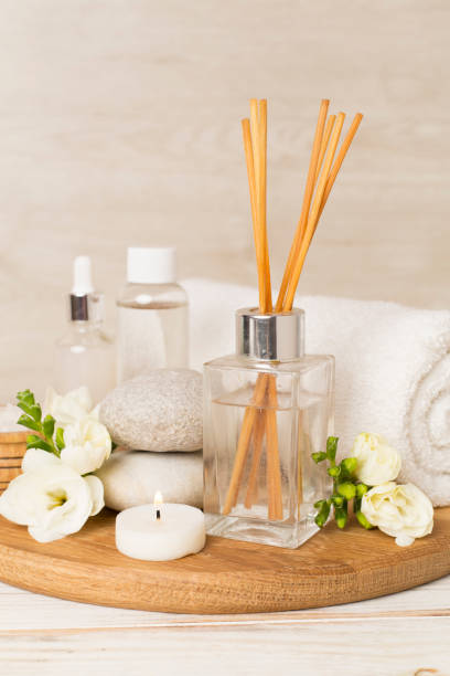 istock Spa composition with freesia flower and aroma diffuser on wooden table 2194976936