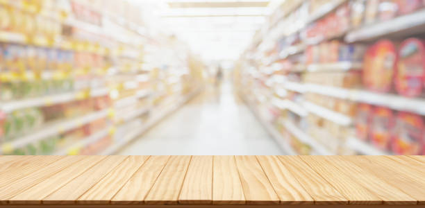 istock Empty wood table top with supermarket blurred background for product display 2194980654