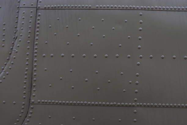 istock Background made of metal coating with rivets. 2194981111