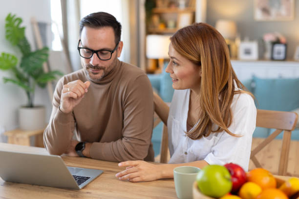 istock Engaged Couple Sharing Ideas Over Laptop Screen 2194981301