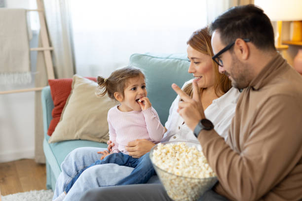 istock Family enjoying popcorn while engaging in joyful conversation 2194981313