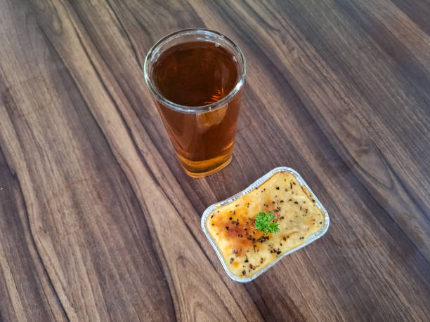 Delicious Beef Lasagna With Beef Meat, Brulee Sauce And Bolognase Sauce. Fresh Tea Iced In Glass. Food And Drink Menu.