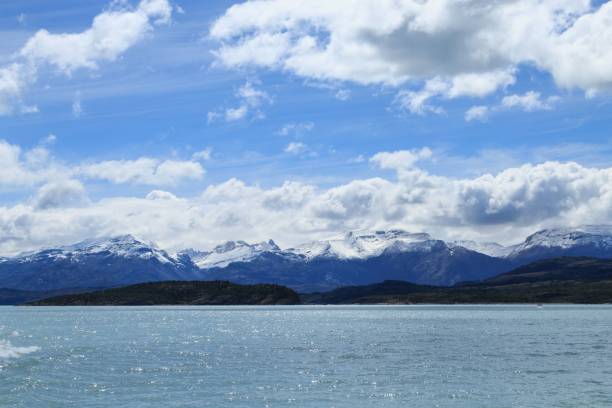 istock Snow-capped mountains under a bright blue sky 2194988760