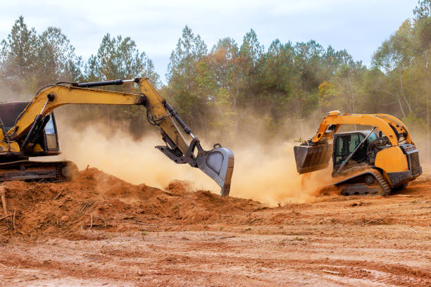 istock Construction bulldozer excavator clearing land in forested area during daytime operation at construction site 2194990796