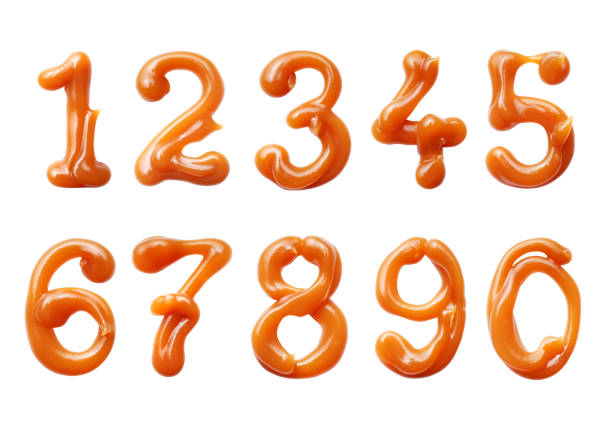 istock Hand drawn numbers with melted caramel close-up isolated on white background 2194993485