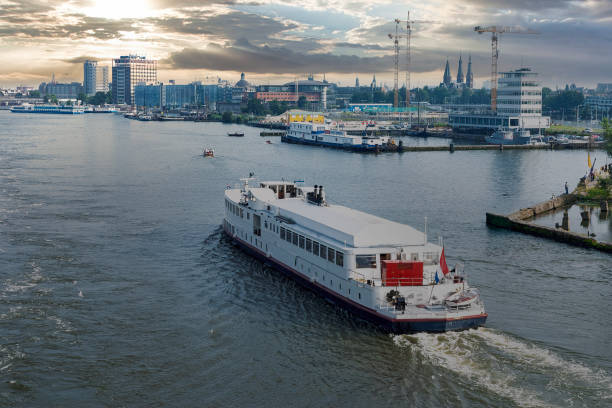 istock Amsterdam city skyline at canal waterfront, Amsterdam, Netherlands 2194995154