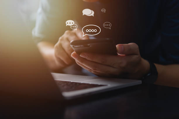 istock A person using a smartphone with chat icons floating, symbolizing online mobile technology, networking, and efficient communication in the digital world. customer support 2195002066