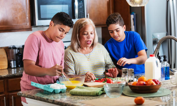 Family canning vegetables in jars in the kitchen. Selective focus. Food.