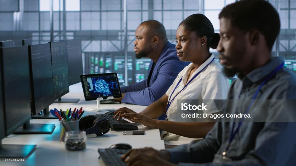 Technicians Using Computers And Tablet In Data Center Implementing Ai ...