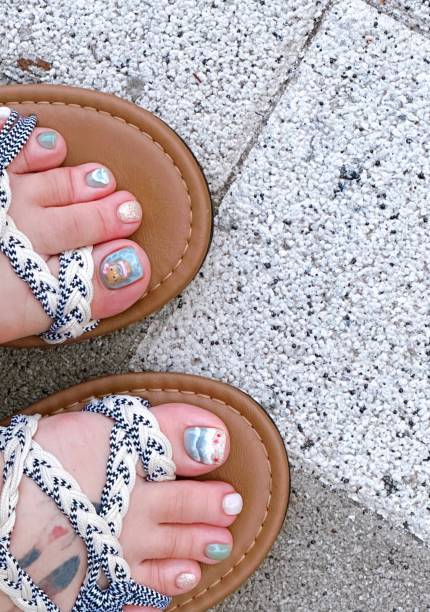 istock Creative nail art featuring intricate designs, vibrant colors, and unique patterns. Perfect for beauty and fashion photography, showcasing trends in nail designs and the artistry of manicure techniques. 2195004141