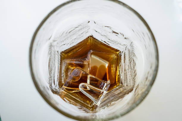 Cold coffee and ice. Beautiful view in a drinking glass. Close up.