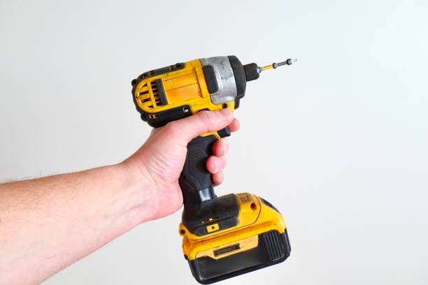 istock Cordless drill in hand on a white background close-up 2195006171
