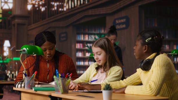 istock African american private teacher offering support to her students 2195011346