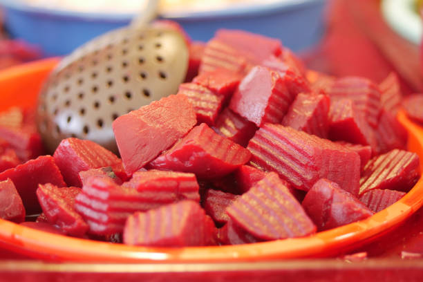A bowl of freshly cut beetroot cubes, perfectly prepared for enjoyment or use in dishes