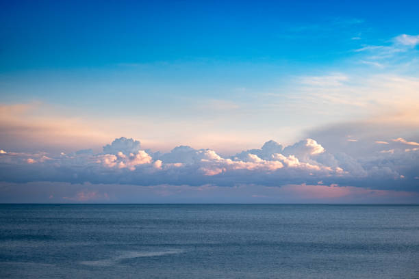 istock clouds and blue sky over the sea at sunset 2195013280