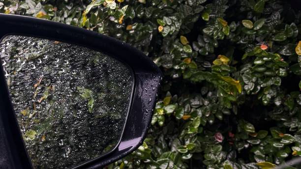 istock raindrops on the car rearview mirror 2195014288