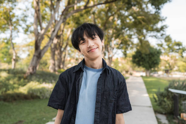istock Generation Z Teenage Boy Looking down at the camera, 2195015000