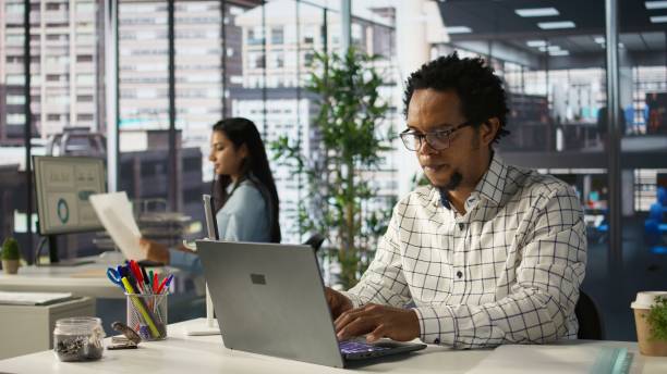 istock African american general manager reviews business forecasts and plans 2195015907