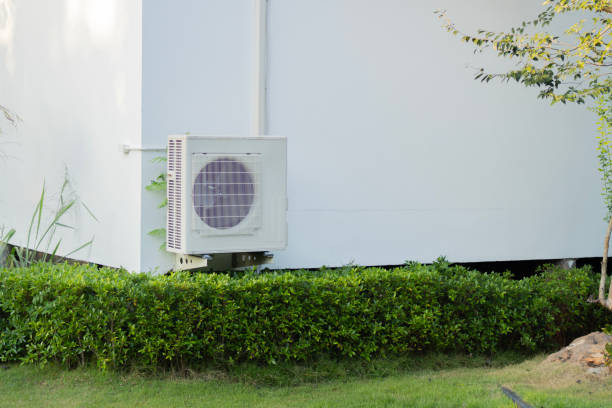 istock Condenser unit or compressor outside home or residential building. 2195016815