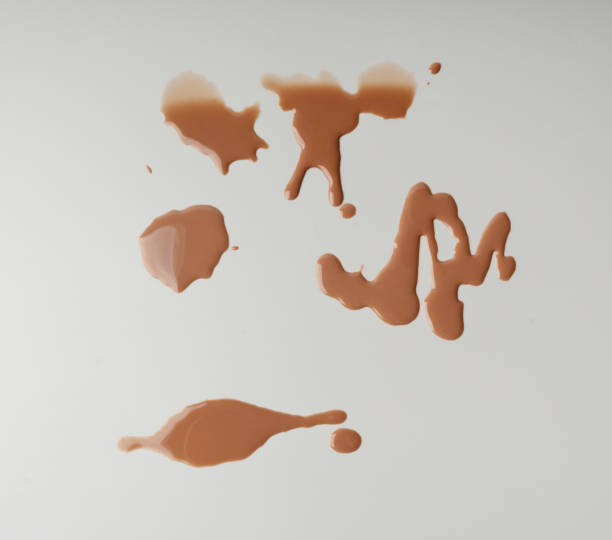 istock Spilled chocolate milk, hot chocolate puddle, liquid stain, coffee splatter, brown latte with on grey 2195017676