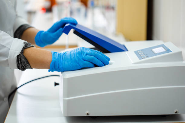 istock Laboratory technician operates scientific equipment for research in a clinical setting during daytime hours 2195017946