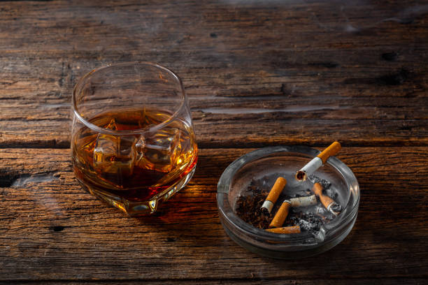 istock Whiskey with an ashtray on wooden background 2195019238