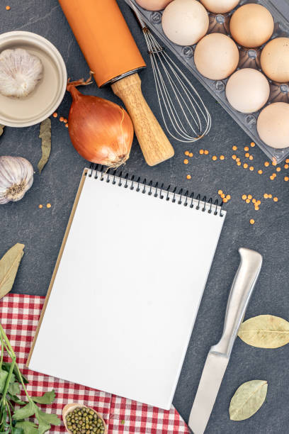 istock Cooking ingredients with blank notebook. Open recipe book with herbs and spices. 2195019661