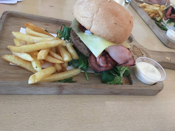 istock Beef and Bacon burger with a side of fries 2195022714