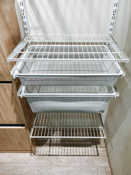 istock This beautifully designed family home features a spacious closet with shelves for organization and practical wall baskets for effective storage, ensuring easy access to essentials 2195025282