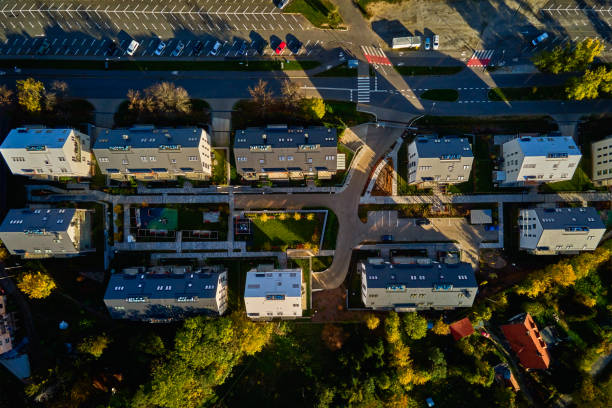 istock Modern residential complex with green spaces, parking spots and autumn trees 2195026031