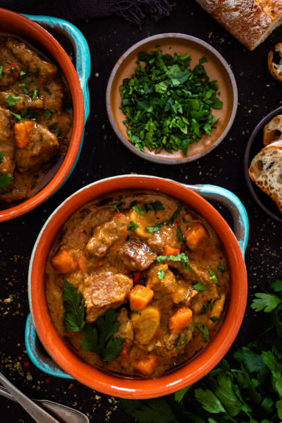 istock Beef goulash with vegetables on black table 2195029131