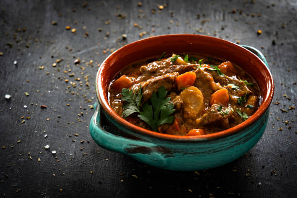 istock Beef goulash with vegetables on black table 2195029159